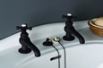 Strom Plumbing - P0012Z Oil Rubbed Bronze Antique Reproduction Individual Basin Faucets with Cross Handles. The P0012 metal cross handles have porcelain buttons for hot and cold.