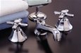 Strom Plumbing - P0152C Mississippi Polished Chrome Plated Widespread Lavatory Faucet with Cross Handles and Pop-Up Drain. Cross handles have porcelain button for hot and cold.