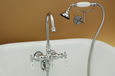 Strom Plumbing - P0155C Polished Chrome Gooseneck Leg Tub Faucet with Wall Mounted Handheld Shower. The P0155 mounts on the tub wall at 3-3/8 inch centers for use with almost any tub on legs.