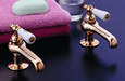 Strom Plumbing - P0587S Supercoat Brass Antique Reproduction Individual Basin Faucets with Porcelain Lever Handles. The P0587C porcelain lever handles indicate hot and cold.