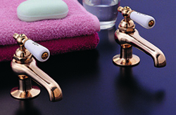 Strom Plumbing - P0587S Supercoat Brass Antique Reproduction Individual Basin Faucets with Porcelain Lever Handles. The P0587C porcelain lever handles indicate hot and cold.